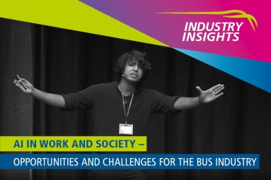 A speaker gestures on stage. The text highlights AI in work and society, specifically for the bus industry.